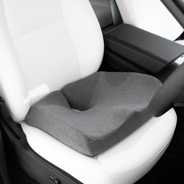 Grey Biggie's Seat Cushion from Fine Foams placed on Tesla's car seat.